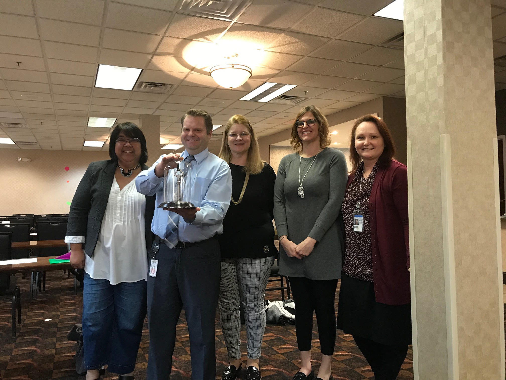 ISD Outreach receives an award at EDHI conference.